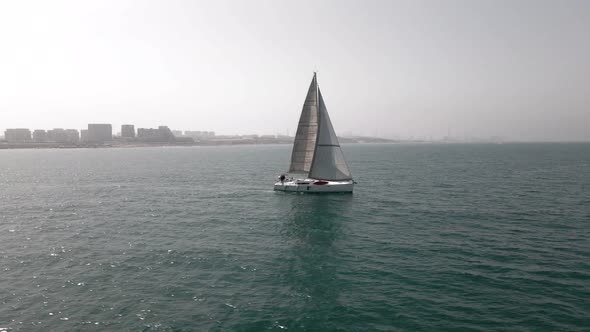 Sailing Ship Yachts with White Sails at Opened Sea