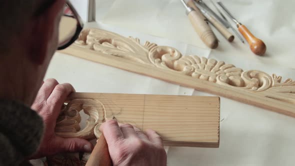 Closeup shoot of a woodcarver at work