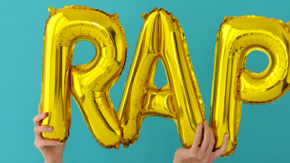 Golden RAP Words Made of Inflatable Balloons alt