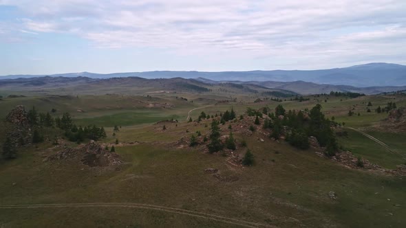 Baikal Valley spirits,Tazheran Steppe, Stone Cliffs on the Road, Aerial Summer alt