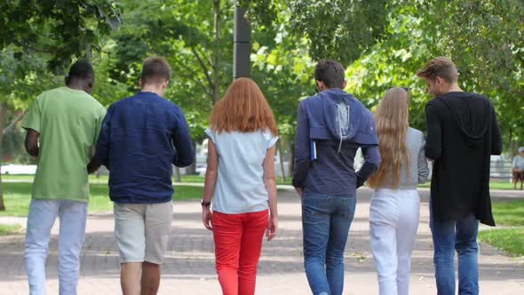 Group Stylish Student with Notebook on Footpath Outdoor alt