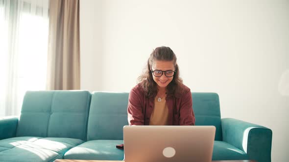 A Young Exited Woman Goes Crazy Because of Good News From the Internet. alt