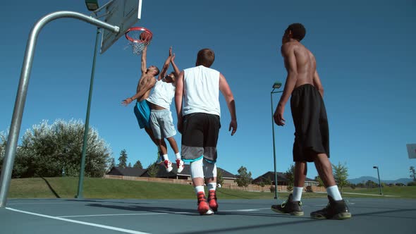 Super slow motion shot of friends playing basketball, shot on Phantom Flex 4K
