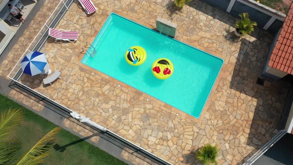 Float smile emoji emoticon icon buoy at swimming pool at countryside ...