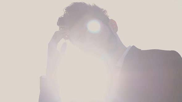 Handsome Man Wearing Office Suit at Back Light Slow Motion alt