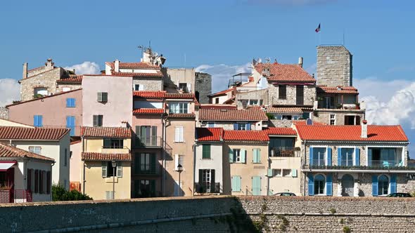 Mediterranean sea coast of Antibes, France. Ancient walls, buildings and cars alt