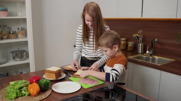 Adorable Deaf Kids Making Sandwiches in Kitchen alt
