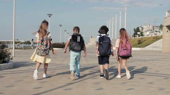 School Kids Walking with Backpacks alt