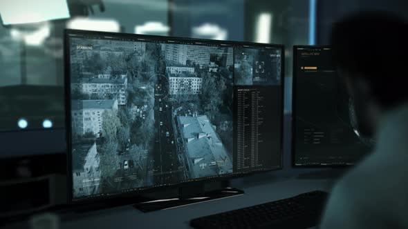 Spy Intelligence Agent Uses Drone Control Software To Scan Automobile On Street alt