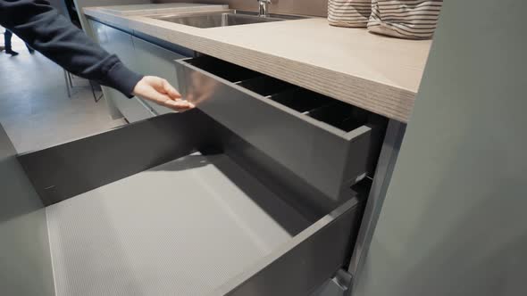 A kitchen showroom gimbal shots of drawers being opened alt