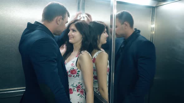 Close View Long Haired Brunette Girl Kisses Handsome Man alt