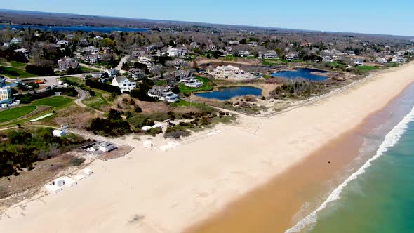 Luxury town of Westerly, RI near vibrant ocean and sandy beach, aerial view alt