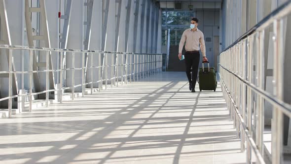 Hispanic Man Successful Businessman Passenger in Formal Clothes Carries Suitcase with Luggage Wears alt