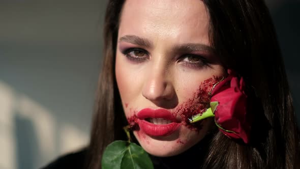 Young Girl with Art Makeup on the Day of the Dead Rose in the Face alt