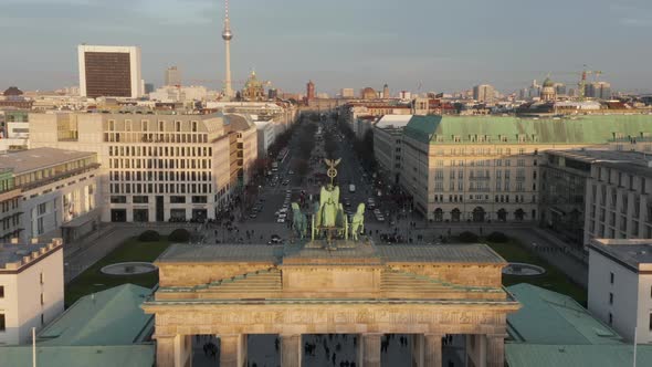 AERIAL: Slowly Approaching Brandenburg Gate and Tiergarten in Beautiful Sunset Sunlight with Close alt