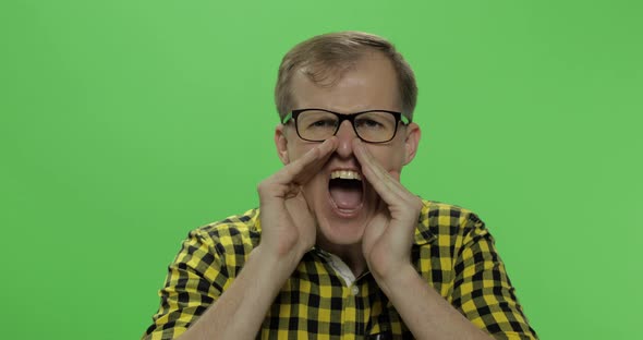 Handsome Young Man in the Yellow Shirt Got Angry and Started Shouting Loudly alt
