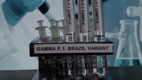 Gamma P.1 Brazil Variant Test Tube Sample Vials Being Taken Off In Rack.  Locked Off alt