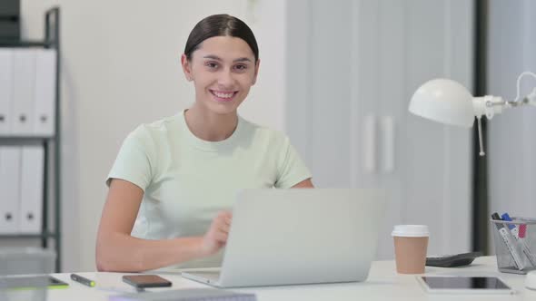 Young Latin Woman with Laptop Showing Thumbs UP alt