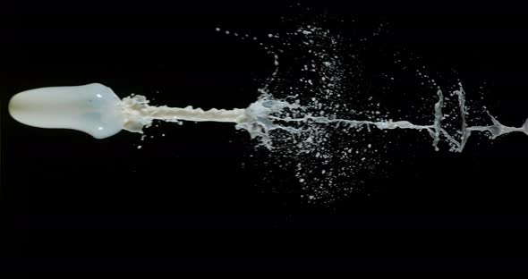 Milk Exploding and Splashing on Black Background, Slow Motion 4K alt