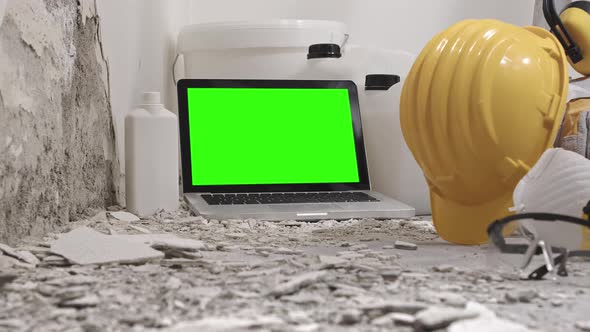 Green screen laptop computer. House renovation concept