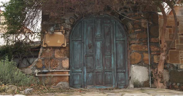 Beautiful Old Wooden Gate Build in Stone Wall