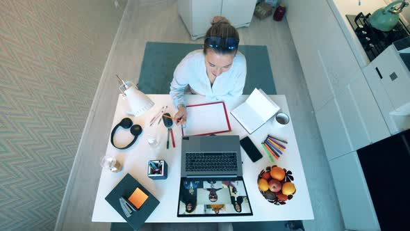 Young Woman Works From Home with Laptop During Quarantine alt
