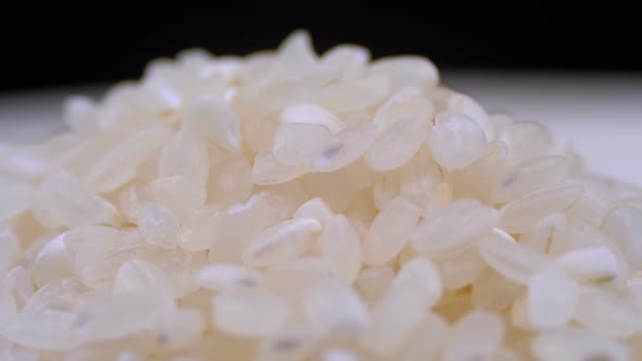 Grains of Raw Rice Rotate Close-up alt