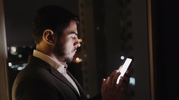 Young Businessman Using Smartphone Tap Phone Screen