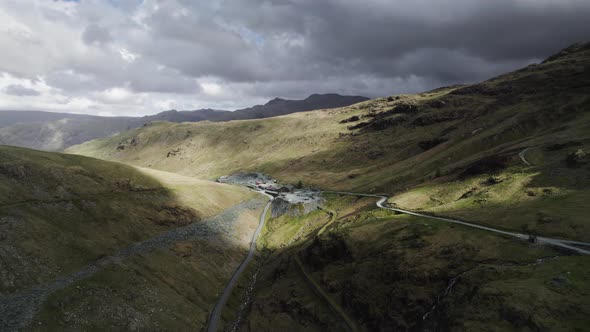 Honister slate mine at the top of Honister pass in the English Lake District. Sunlight breaks throug alt