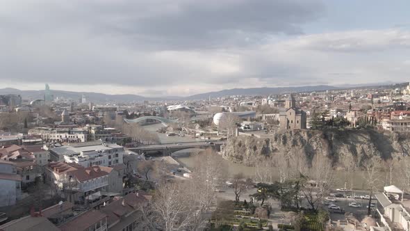 Aerial view of Metekhi church in old Tbilisi located on cliff near river Kura. Georgia 2021 Spring alt