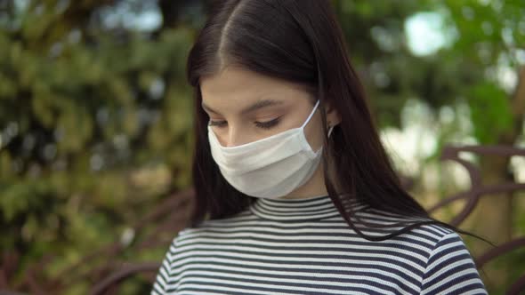 Woman in Medical Protective Mask Working with Laptop on Quarantine