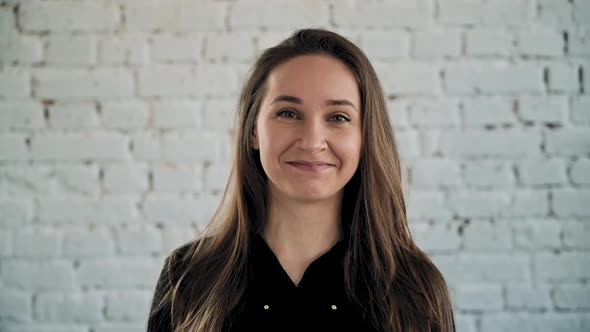 Girl Raises His Head Opens Beautiful Green Eyes and Smile alt