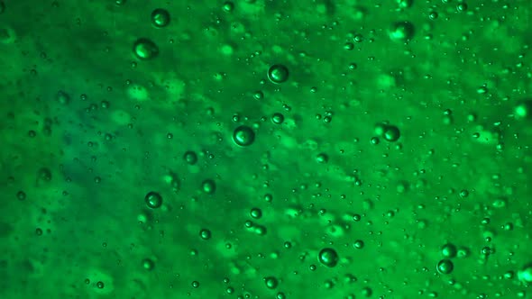 Green Gel and Bubbles Moving Fast