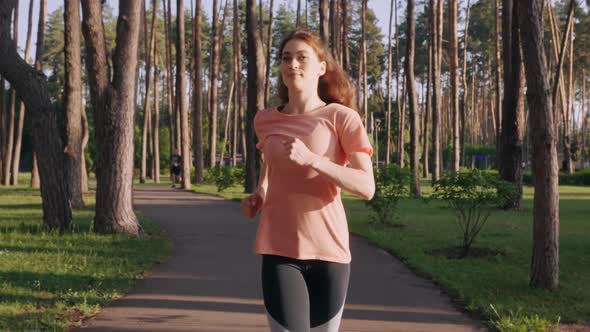 Sportswoman Jogging Outdoors