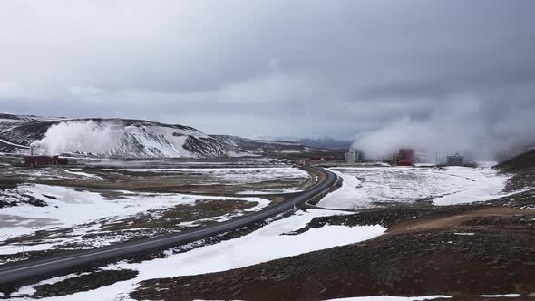 View of Steaming Cooling Tower at Krafla Geothermal Power Plant in Iceland alt