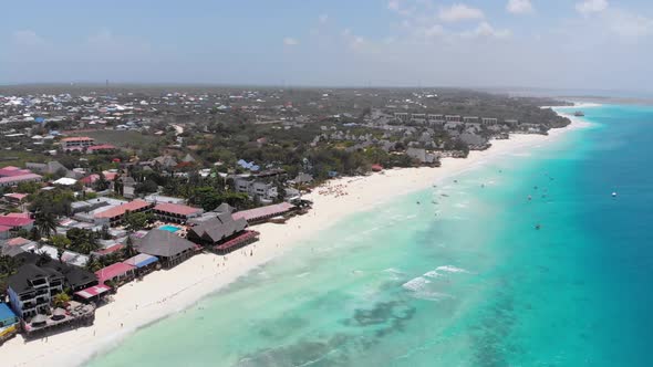 Aerial Paradise Sandy Beach with Turquoise Ocean and Luxury Hotels in Zanzibar alt