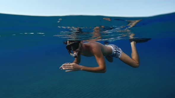 Diving Underwater the Sea With Long Fins alt