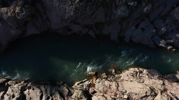 footage of river with stone banks alt