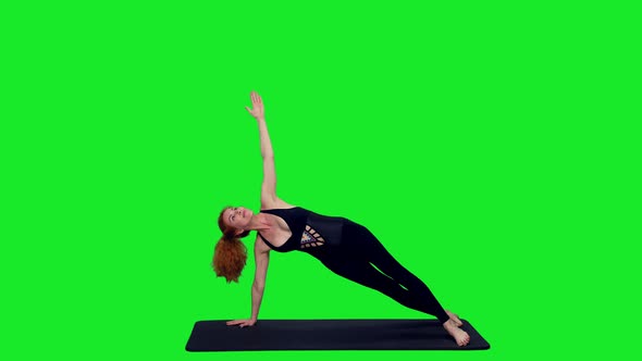 Slim Woman Doing Yoga Exercises On Green Screen