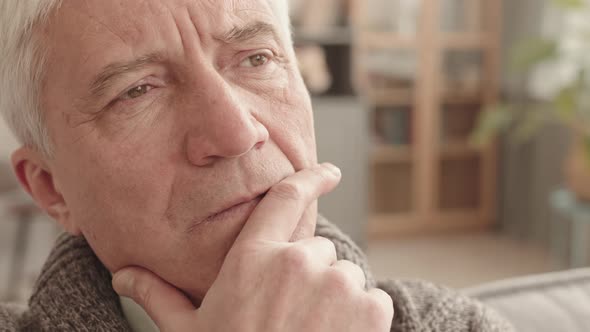 Face of Pensive Senior Man at Home alt