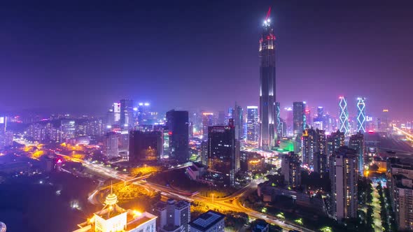 Big Chinese city at night with bright lights of buildings