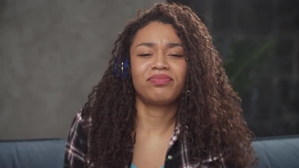 Mixed Race Female in Headphones Swaying To the Beat alt