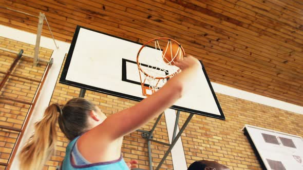 High school team playing basketball alt