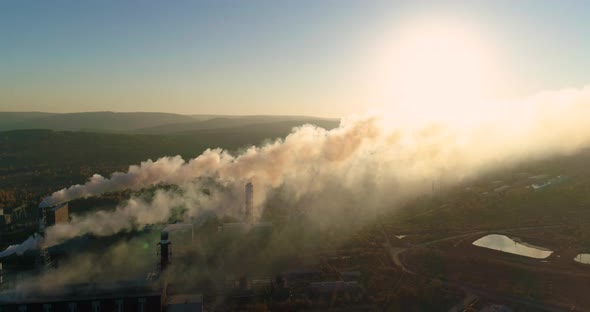  Smokestacks of a Metallurgical Plant at Sunset. Air Pollution Concept.