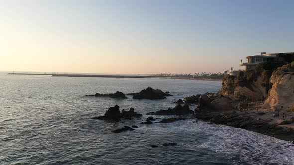 Flying over the beautiful Laguna Beach tide pools at Sunset in California. alt