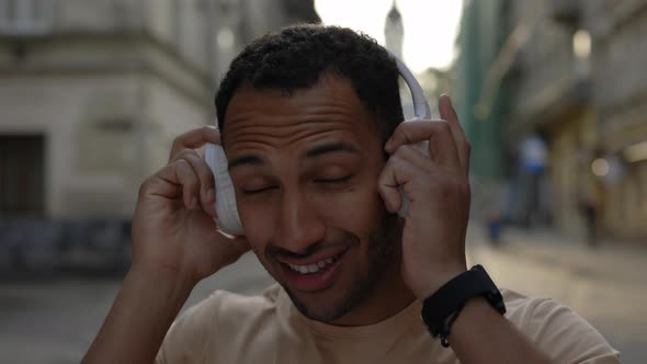 Smiled African American Male Runner Wearing the Headphones alt