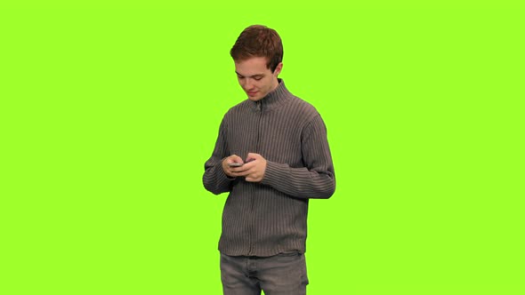Portrait of Young Man Texting Sms