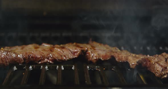 Skirt Steak Being Grilled With Flames 57b