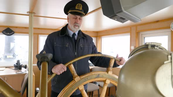 Portrait Captain Of Ship Holding Steering Wheel On Captain Bridge ...