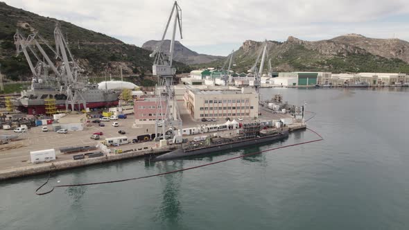 Submarine being repaired on marine naval base, Aerial orbit, Cartagena military port. Spain